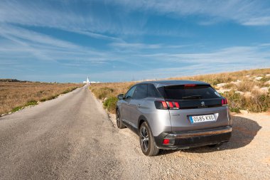 Menorca, Spain - October 13, 2019: Peugeot 3008 SUV car parked along the road. Menorca island.