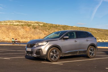 Menorca, Spain - October 13, 2019: Peugeot 3008 SUV car parked on the coast of Menorca island.