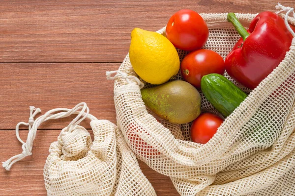 Fruits and vegetables in a cotton eco shopping bag. No waste concept