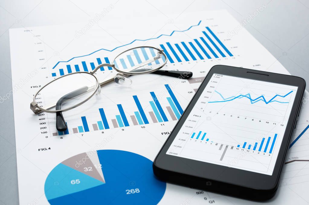 Business document, glasses and smartphone on gray reflection bac