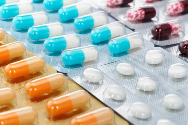 Many capsule medicines, pills and tablets. — Stock Photo, Image