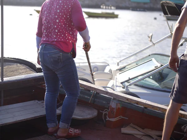 People Mooring Boats