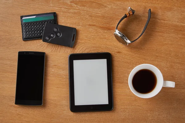 E-book device with other objects on a table