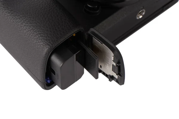 Battery and sdxc memory card in a camera slot — Stock Photo, Image