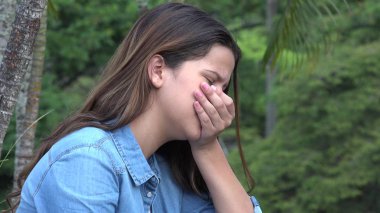 Hispanic Teen Girl Tearful With Emotional Pain clipart