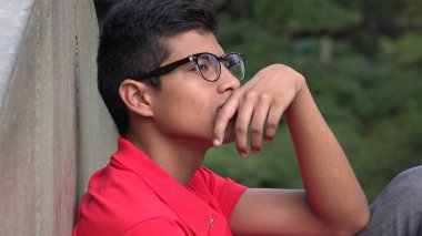 Intelligent Teen Hispanic Boy Thinking clipart