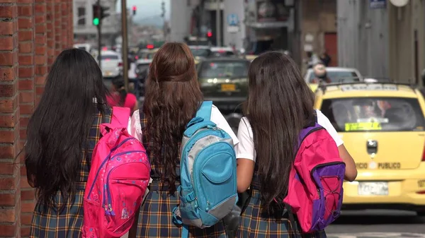 Inner City School Kids With Backpacks Walking To School