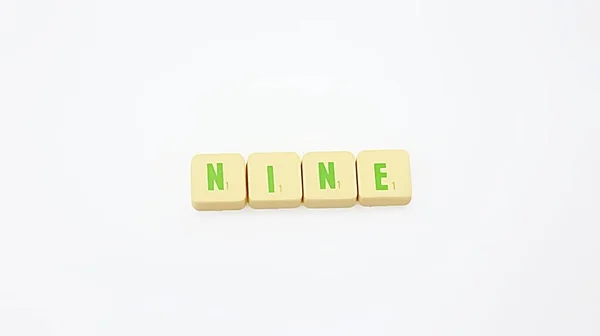 Letter Tile Word Nine — Stock Photo, Image