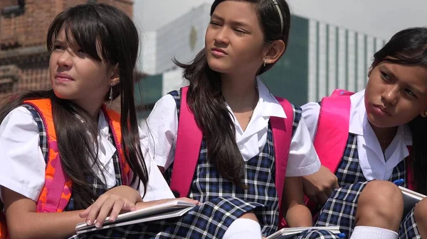 Staring Diverse Female Students Wearing School Uniforms — Stock Photo, Image