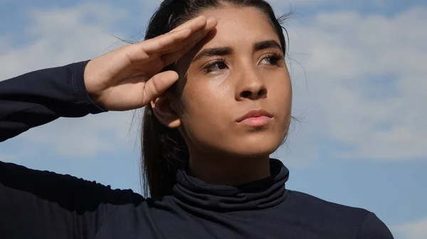 Hispanic Female Youngster Saluting