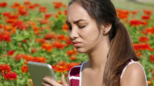 Sad Female Teen Girl Using Tablet