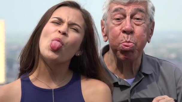 Hispanic Grandfather And Granddaughter Funny Faces — Stock Video