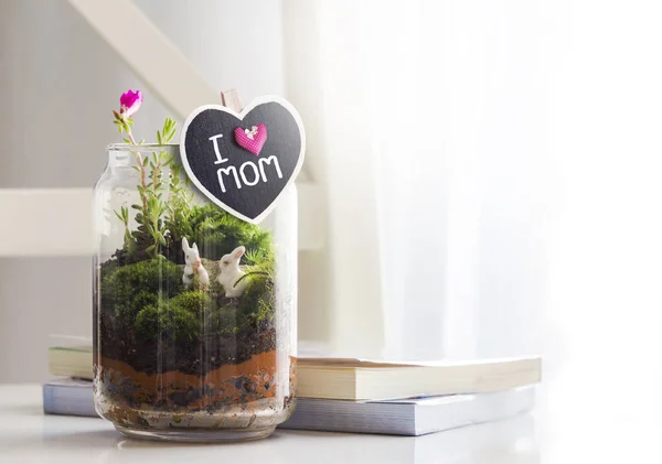 Heart wood with i love mom and bottle garden decoration in the living room — Stock Photo, Image