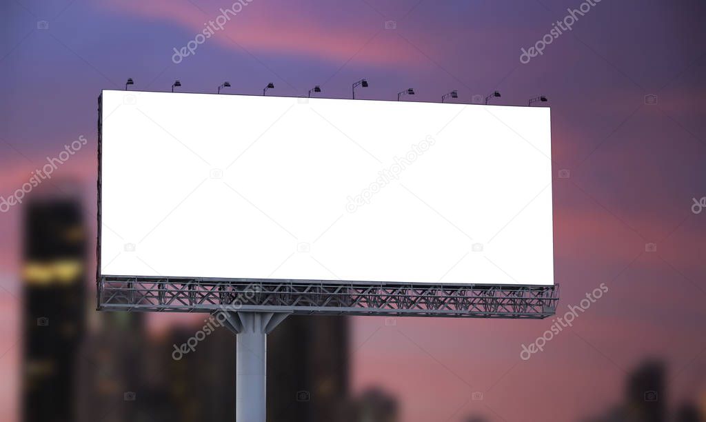 Blank billboard at twilight in the city