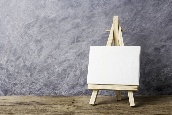 Blank canvas frame on easel painting