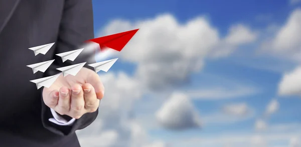 Leadership concept of business woman hand and paper planes with blue sky — Stock Photo, Image