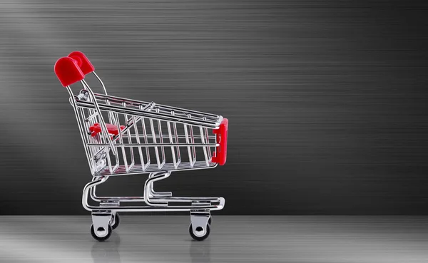 Shopping cart on metal background — Stock Photo, Image