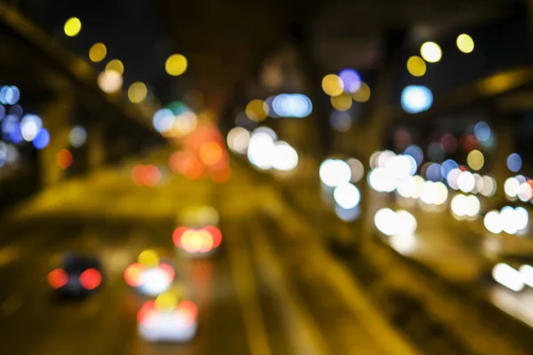 Resumen borroso bokeh fondo de la luz del coche en la calle en la ciudad — Foto de Stock