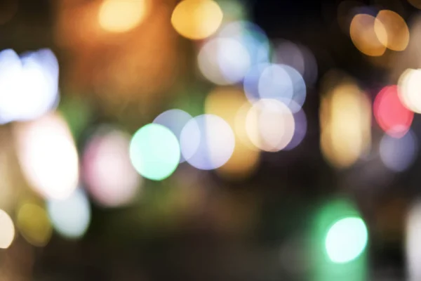 Abstract blurred bokeh background of light decoration in the city — Stock Photo, Image
