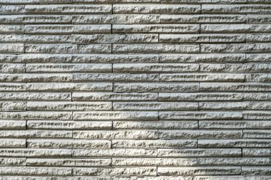 Güneş ışığı ile doku arka plan taş duvar