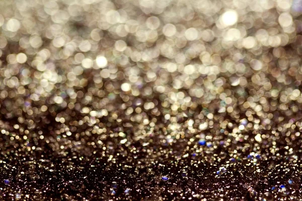 Astratto sfondo glitter di colore scuro con luce splendente e bokeh morbido, colori festivi — Foto Stock