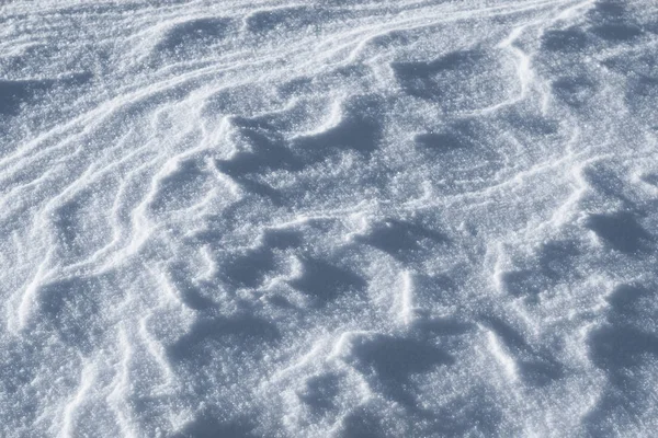 Nieve textura natural en el fondo de invierno de cerca — Foto de Stock