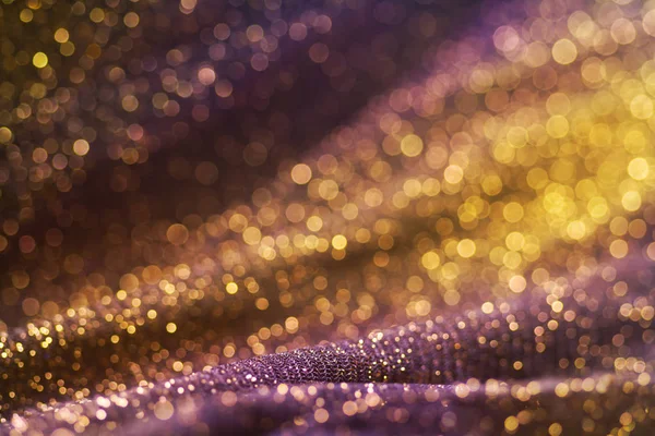 Glitter ve parlaklık çok şaşırtıcı bokeh parlayan renkli. Karanlık soyut rüya gibi wunderful ışıltı arka plan