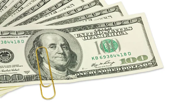 One hundred dollar banknotes with golden paper clip on it close up — Stock Photo, Image