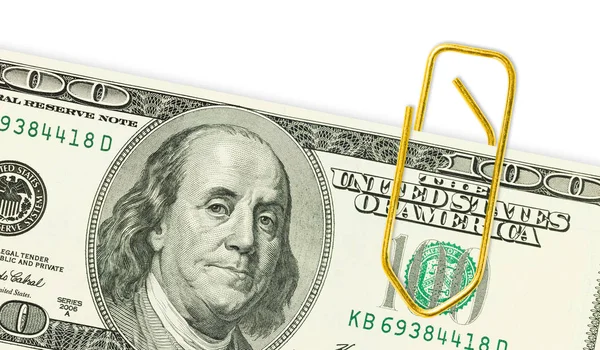 One hundred dollar banknote with golden paper clip on it close up — Stock Photo, Image