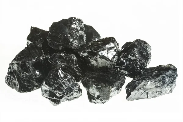 Black coal mine close-up with large depth of field. Anthracite coal bar isolated on white background — Stock Photo, Image