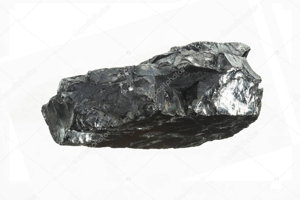 Black coal mine close-up with large depth of field. Anthracite coal bar isolated on white background