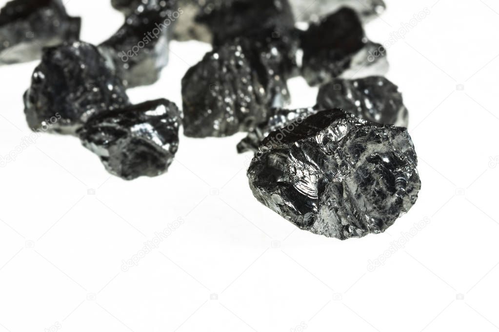 Black coal mine close-up with large depth of field.Anthracite coal bar isolated on white background