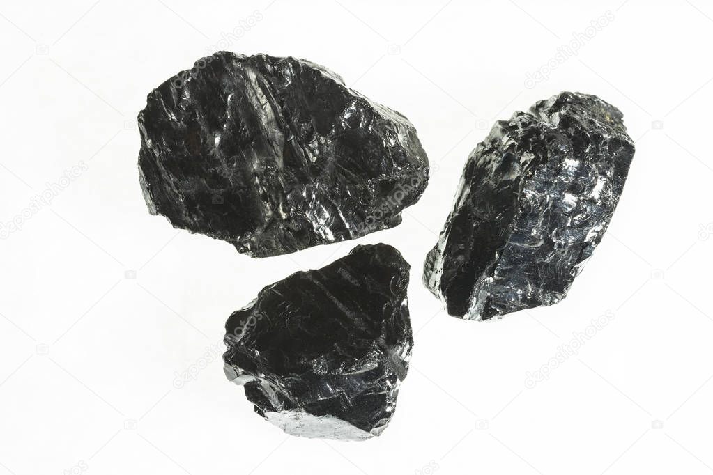 Black coal mine close-up with large depth of field.Anthracite coal bar isolated on white background