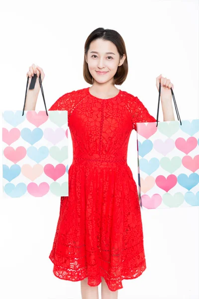 Mujer Alegre Llevando Bolsas Compras Posando Sobre Fondo Blanco —  Fotos de Stock