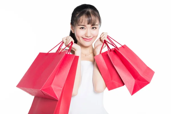 Cheerful Woman Carrying Red Shopping Bags White Background — Stock Photo, Image