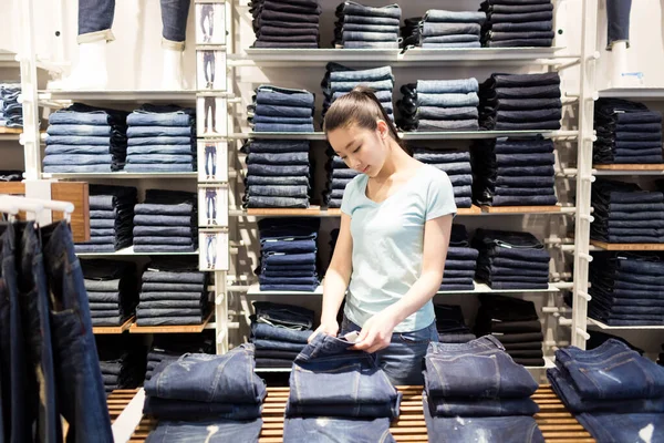 beautiful chinese girl in the mall to choose their own clothing