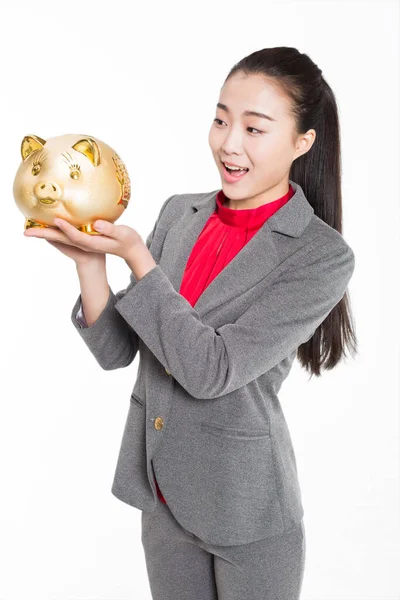 Menina Chinesa Vestindo Terno Cinza Segurando Banco Porquinho — Fotografia de Stock