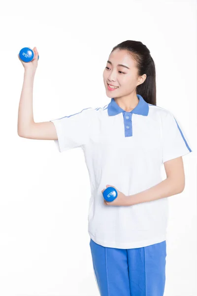 Irl Wearing Short Sleeved Uniform Holding Physical Education Dumbbell — Stock Photo, Image