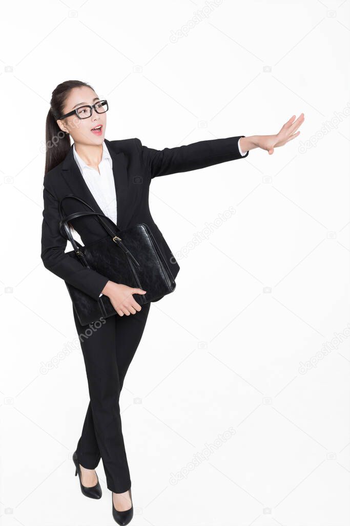 girl wearing a black suit and carrying a black briefcase