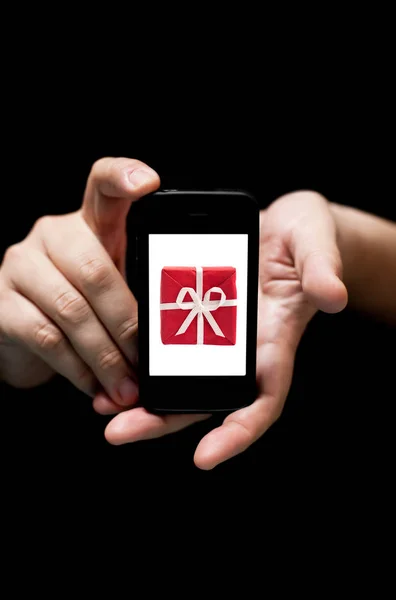 Hands Holding Smartphone, showing  a Red  Gift Box — Stock Photo, Image