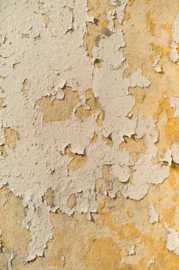 Eski gerçek duvar grunge doku boya, sarı tonları, dikey ben
