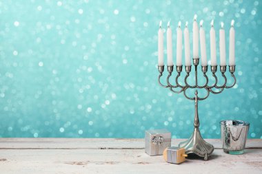 Hanukkah celebration with menorah clipart