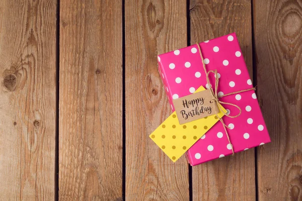 Gift box on wooden background. — Stock Photo, Image