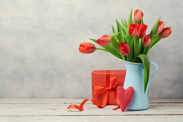 Tulip flowers and gift box — Stock Photo, Image