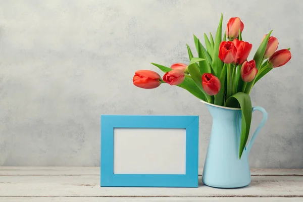 Tulip flowers and photo frame — Stock Photo, Image