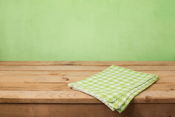 Table with checked tablecloth — Stock Photo, Image