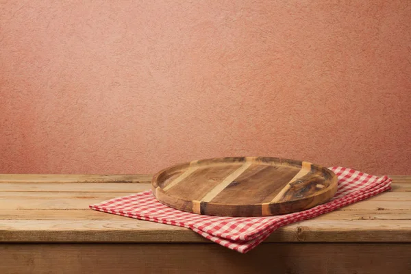 Empty wooden tray on tablecloth — Stock Photo, Image