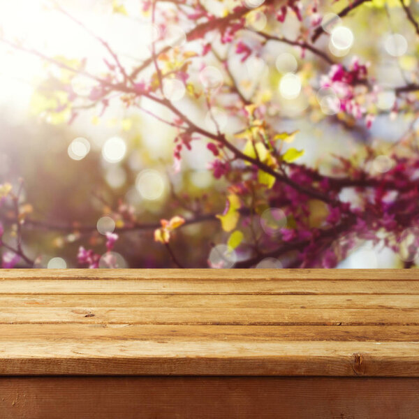 deck table over spring blossom tree