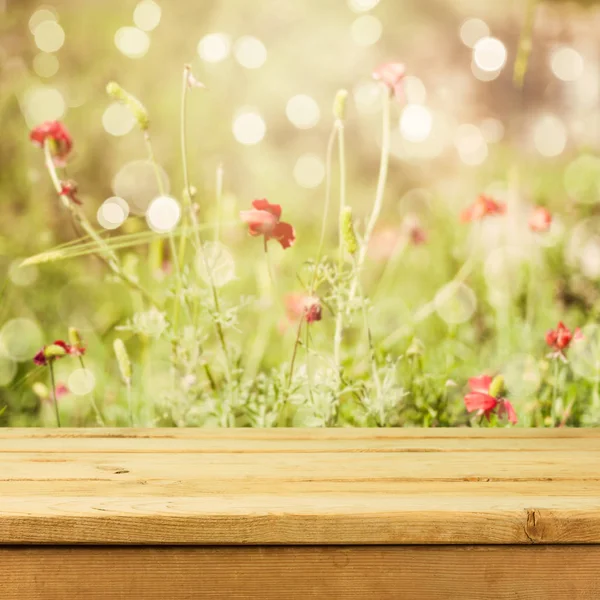 Deck table over flowers — Stock Photo, Image