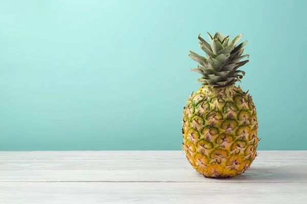 Pineapple on wooden table — Stock Photo, Image